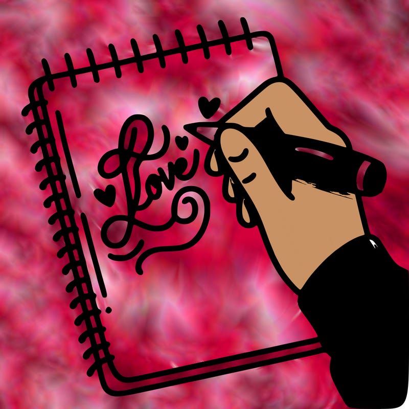 a hand writing “love” in calligraphy on a notebook