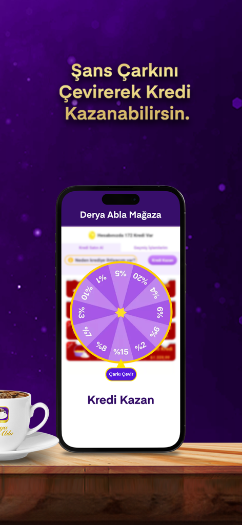 Derya Abla Kahve Falı - Screenshot dell'app Derya Abla che mostra la funzione del gioco della ruota della fortuna per guadagnare crediti accanto a una tazza di caffè turco