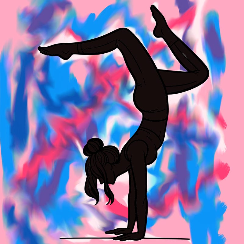 a woman doing a handstand