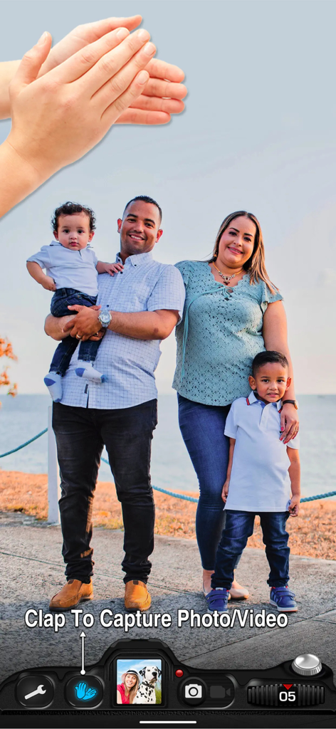 A family posing for a group photo using the clap to capture feature in the Timer Auto Camera app
