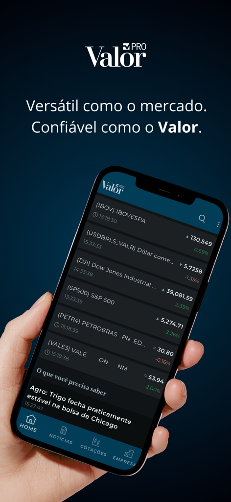 실시간 주식 시장 시세 및 금융 뉴스를 표시하는 Valor PRO 앱 인터페이스를 보여주는 아이폰을 들고 있는 손
