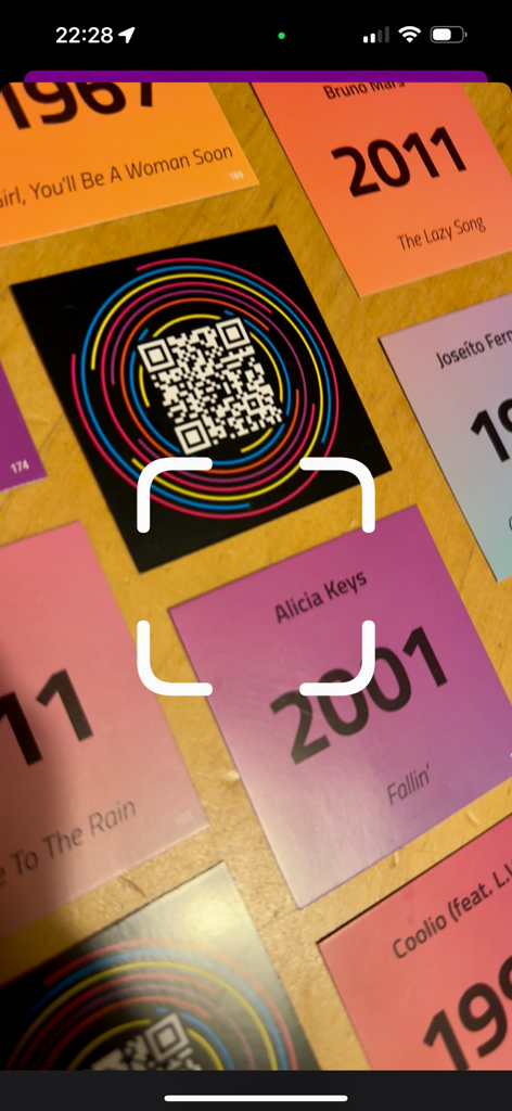 Beatster - Beatster app scanning a QR code on a music trivia card for a game night