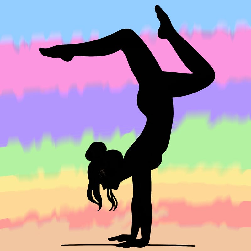 a woman doing a handstand
