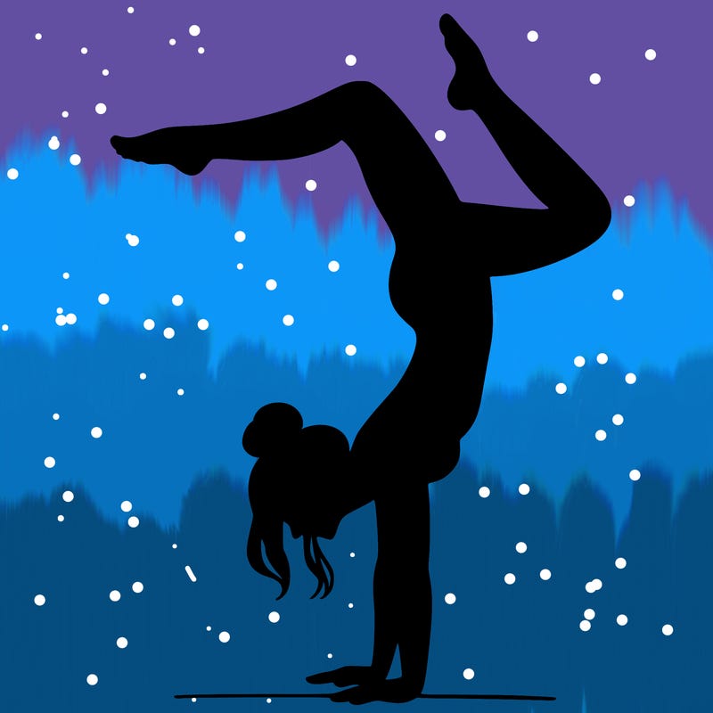 a woman doing a handstand