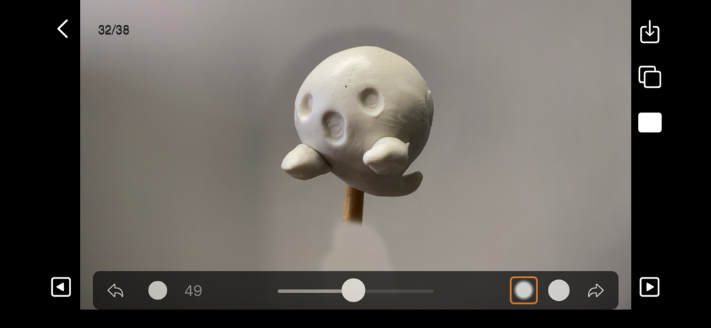 Stop Motion Plus app interface showing the editing panel with a white clay ghost figure