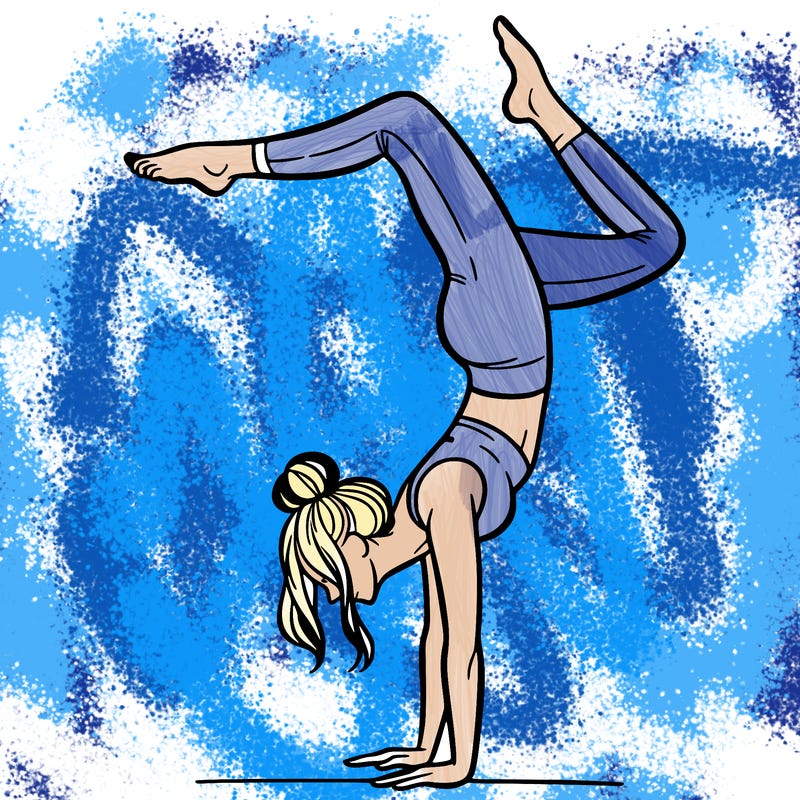 a woman doing a handstand