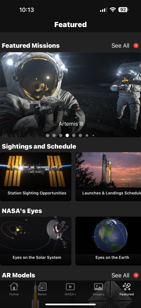 NASA - The Featured screen of the NASA app showing the Artemis mission and space station sighting opportunities.