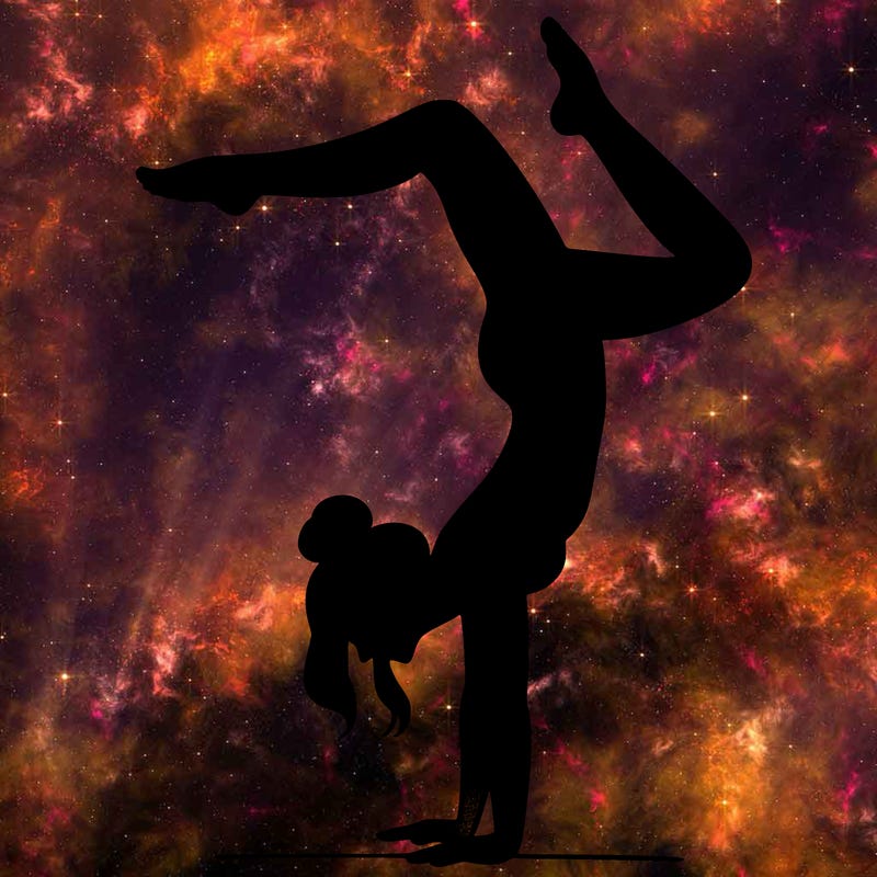 a woman doing a handstand