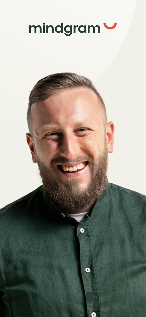 Mindgram - A smiling professional man representing a satisfied user of the Mindgram mental health and wellbeing platform