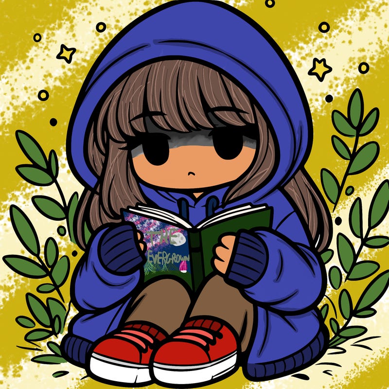 girl in oversized hoodie reading a book