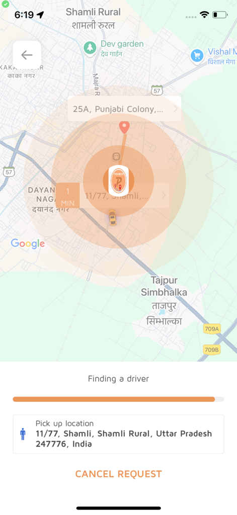 Mobile app screen showing a map with a search for a driver, estimated wait time, and pick-up location details.
