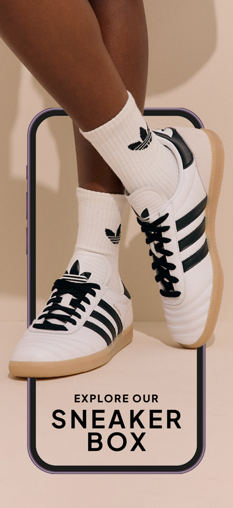 Person wearing white Adidas Samba sneakers and socks featured in the Superbalist sneaker box