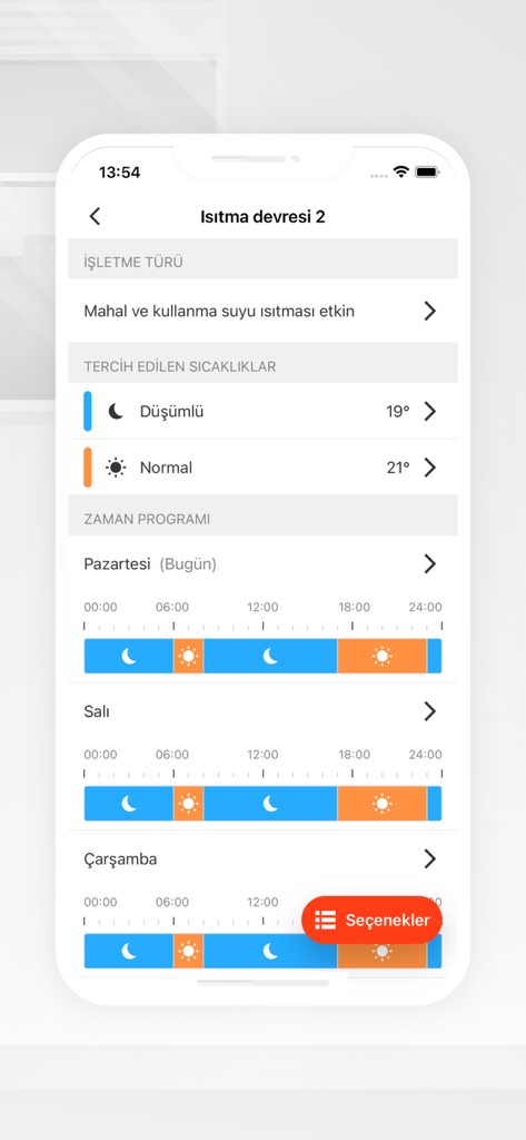 Écran du smartphone affichant le programme de chauffage hebdomadaire et les réglages de température dans l'application ViCare
