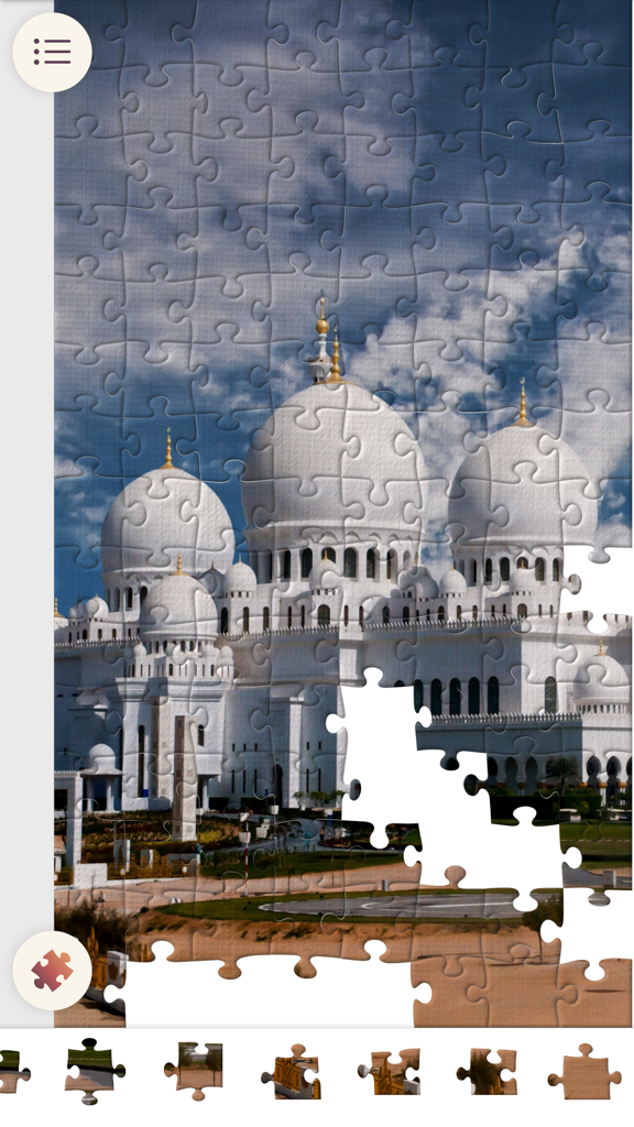 Puzzle.Plus – Classic jigsaw puzzle in your hands - Digital jigsaw puzzle of a white domed mosque with puzzle pieces at the bottom ready to be placed.