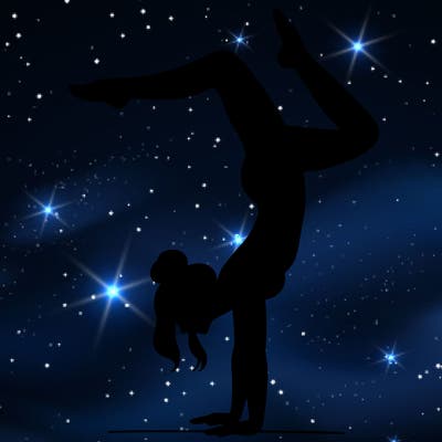 a woman doing a handstand