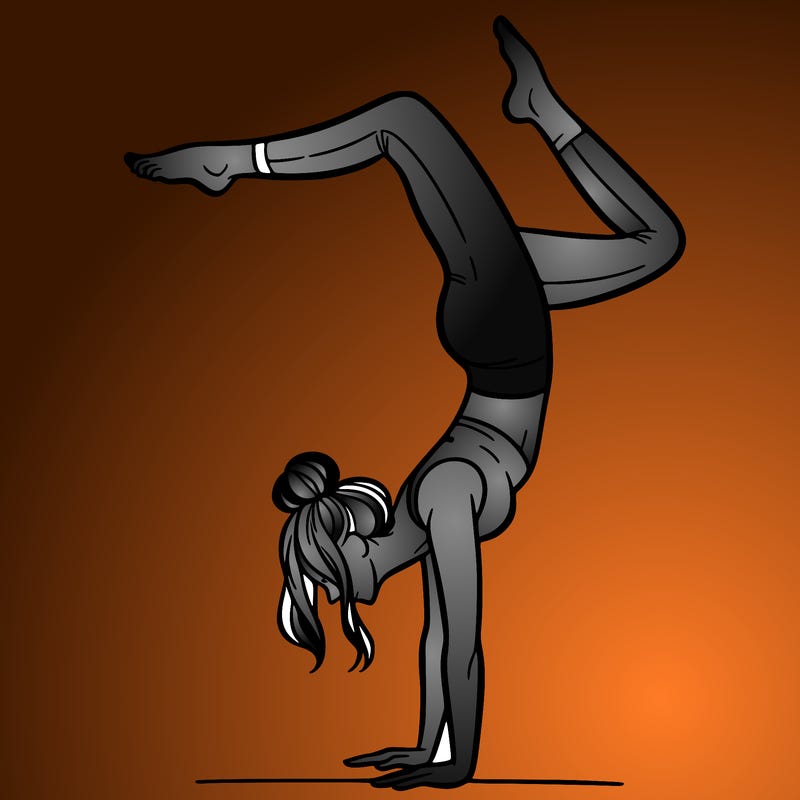 a woman doing a handstand