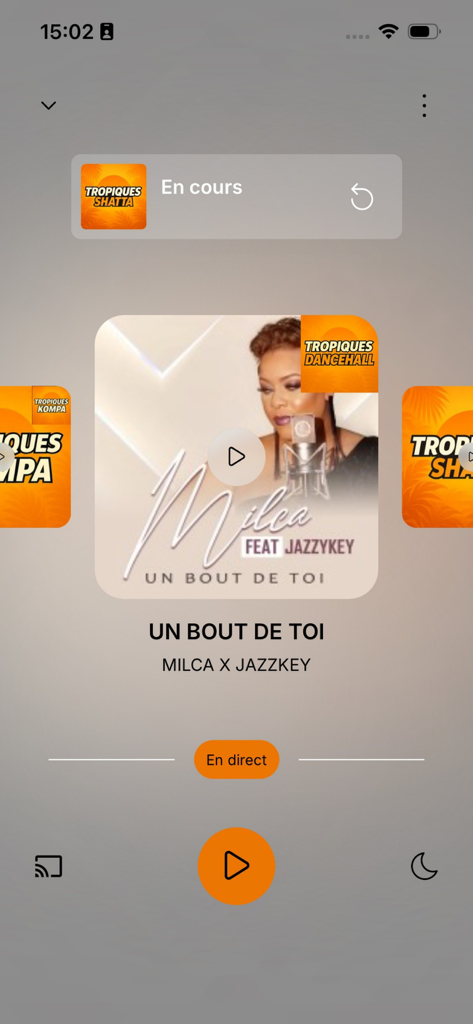 Écran du lecteur de musique de l'application Tropiques FM affichant les informations sur la chanson et les commandes de lecture.