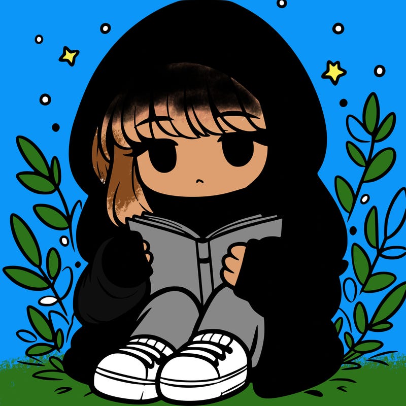 girl in oversized hoodie reading a book