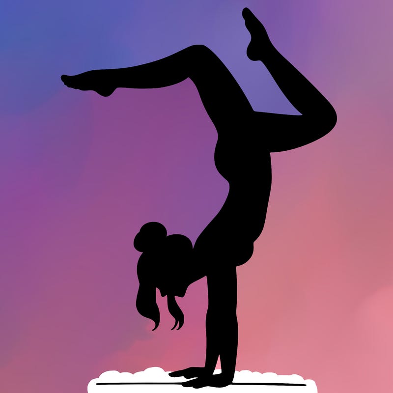 a woman doing a handstand