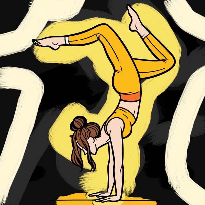 a woman doing a handstand