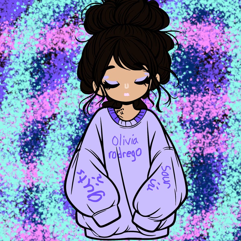 girl with baggy sweatshirt and messy bun