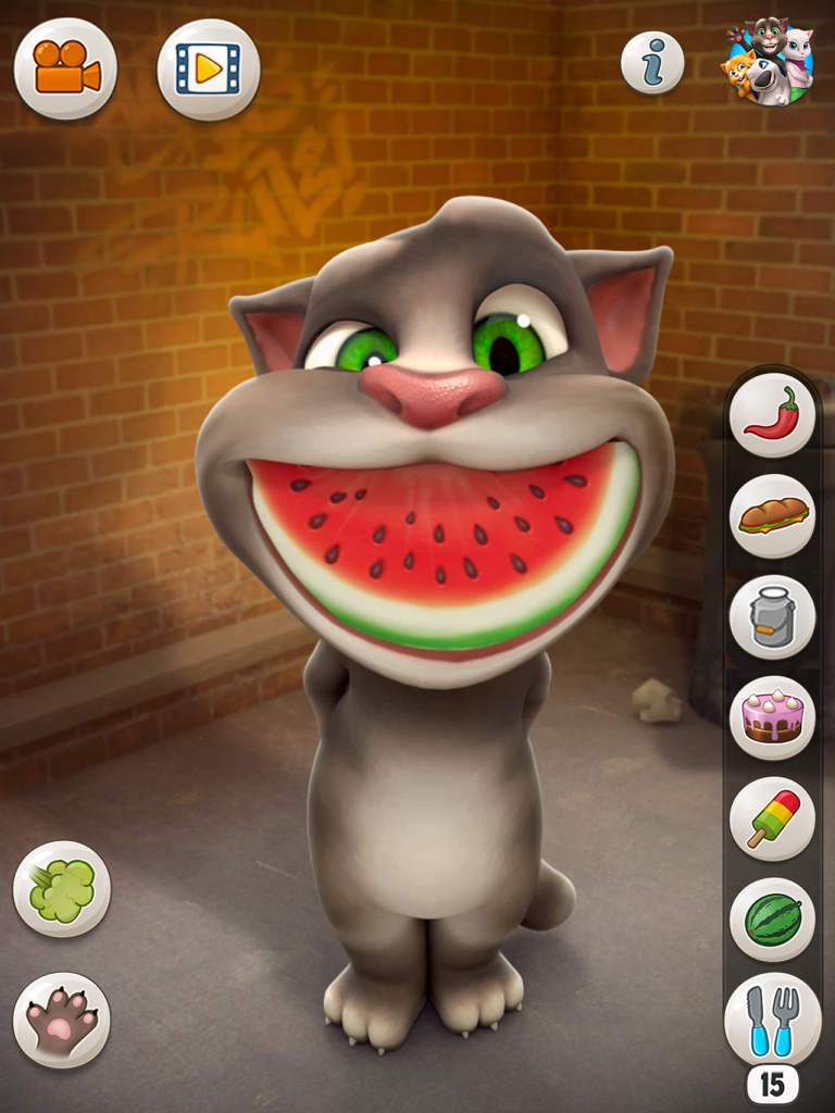 Talking Tom Cat with a giant slice of watermelon in his mouth on iPad screen