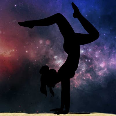 a woman doing a handstand