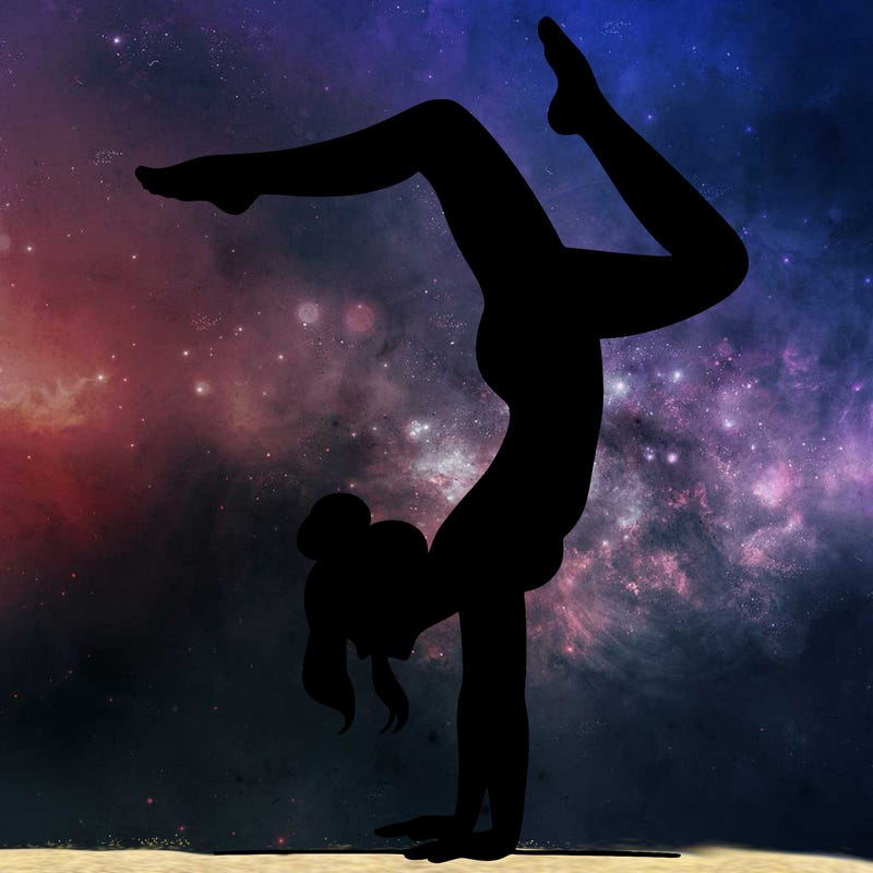 a woman doing a handstand