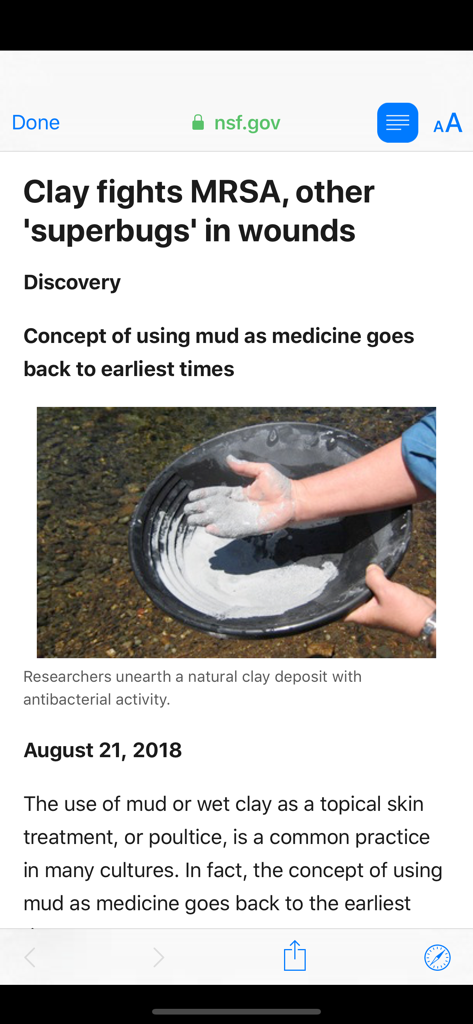 Science Now - Screenshot of a scientific article in the Science Now app discussing how clay fights MRSA and other superbugs with a photo of a hand in clay