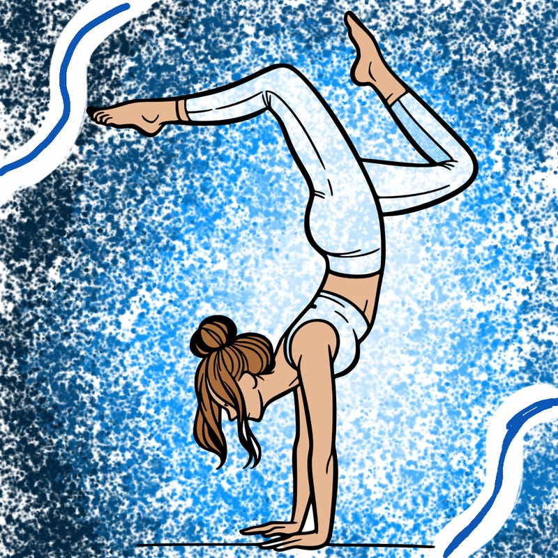 a woman doing a handstand