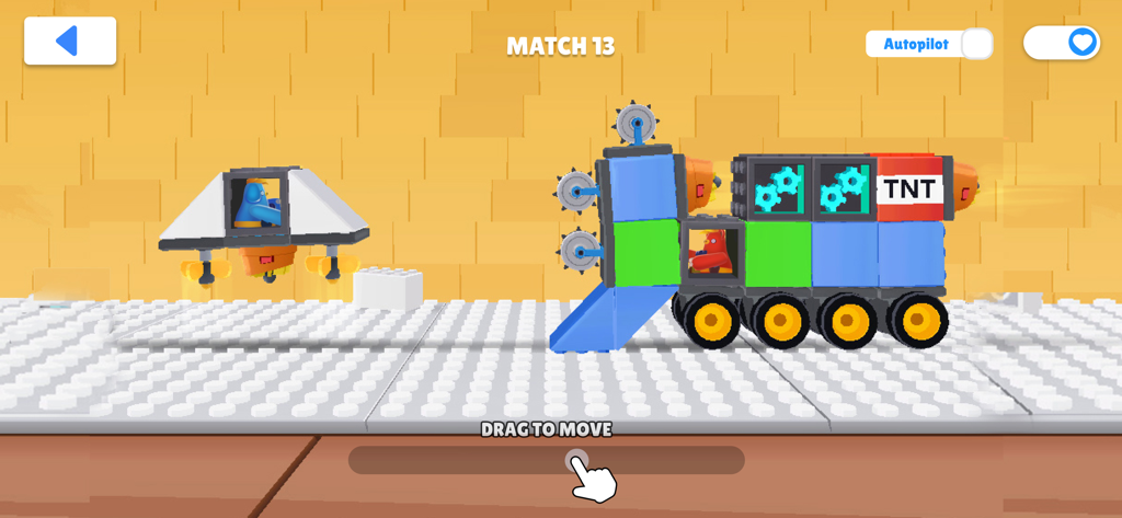 A custom toy tank built from blocks facing an opponent in a physics-based battle arena.