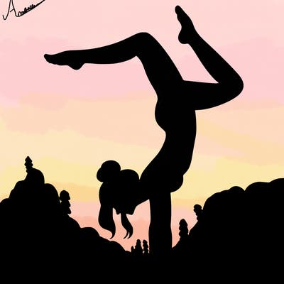a woman doing a handstand