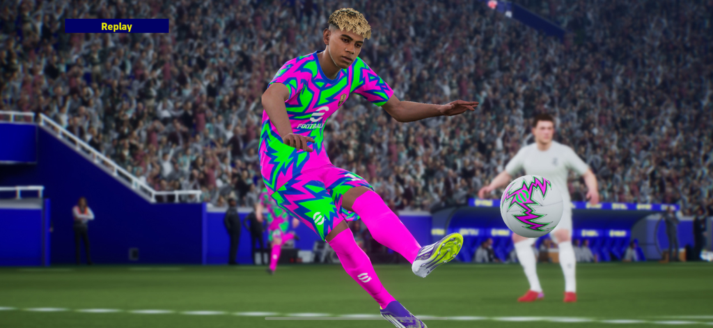 An eFootball player in a vibrant pink and green kit kicking a soccer ball in a crowded stadium during a replay