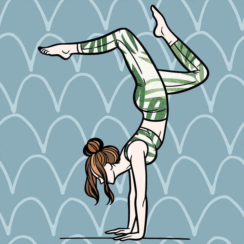 a woman doing a handstand