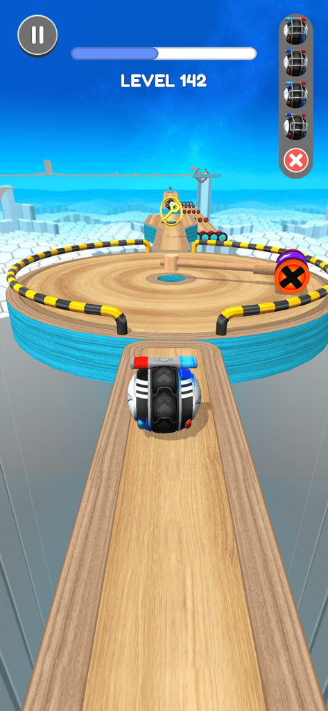 A police car themed ball rolling on a wooden obstacle course