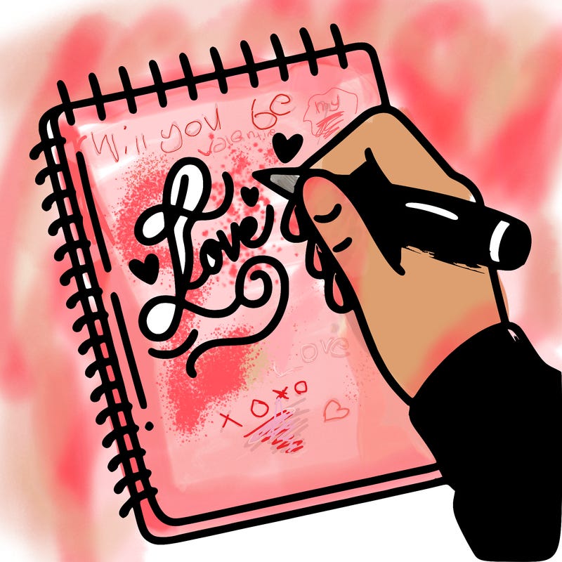 a hand writing “love” in calligraphy on a notebook