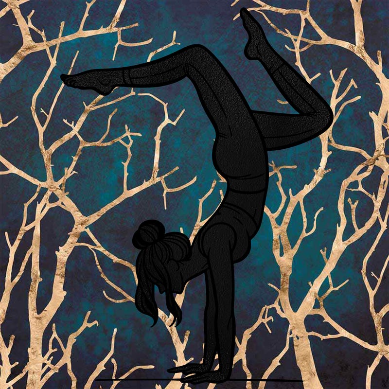 a woman doing a handstand