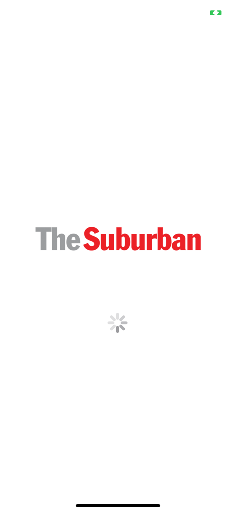 Splash screen of The Suburban Newspaper mobile app featuring its red and grey logo and a loading spinner
