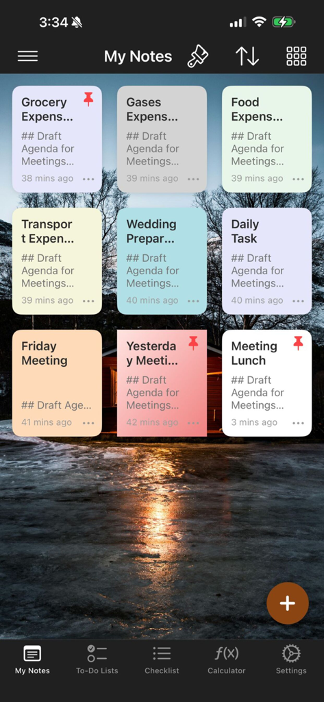 Note Book App - Una cuadrícula de notas codificadas por colores mostrada sobre un fondo de pantalla de un paisaje de atardecer escénico en la App Bloc de Notas.