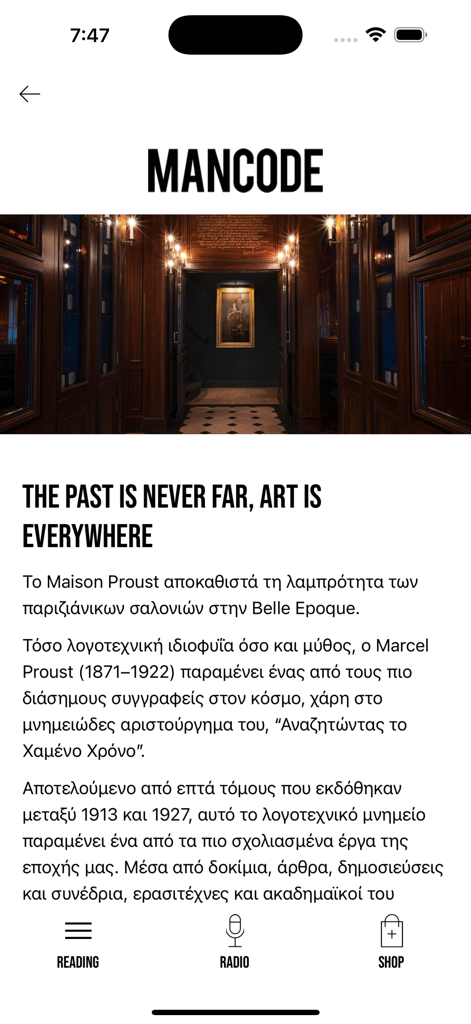 MANCODE app screenshot showing the reading section with an article about Maison Proust and an elegant wood-paneled hallway image.