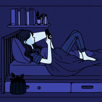 a girl laying on her bed with her phone