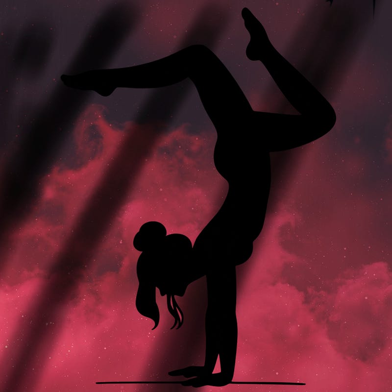 a woman doing a handstand