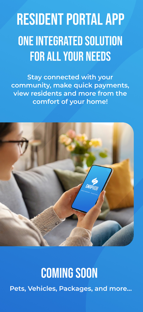 A resident using the SnapHOA mobile app on her phone while sitting on a living room sofa.