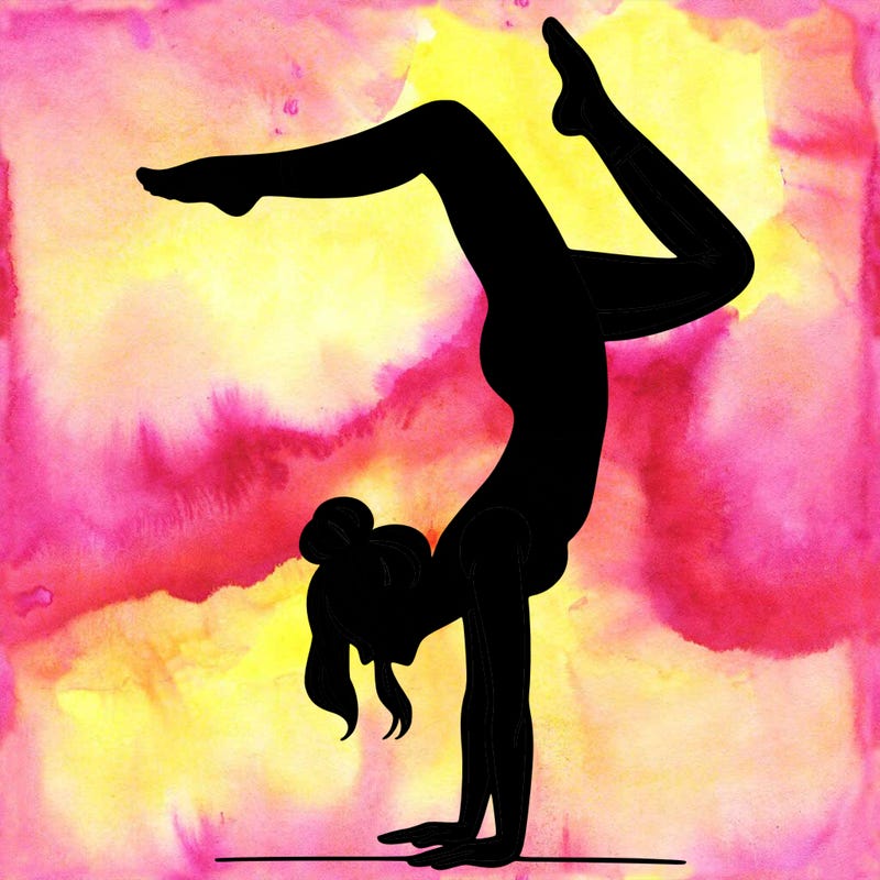 a woman doing a handstand