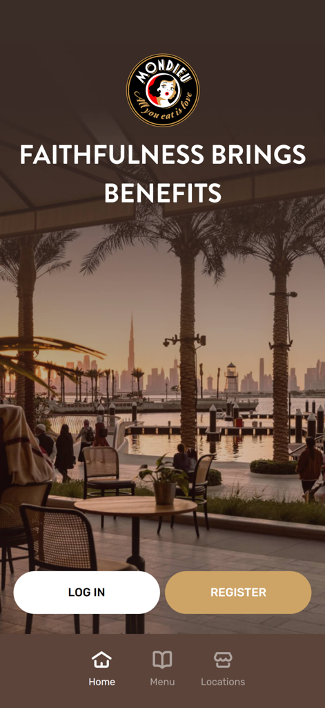 Mondieu - Mondieu loyalty app welcome screen featuring a bistro terrace with a city skyline view and login options.