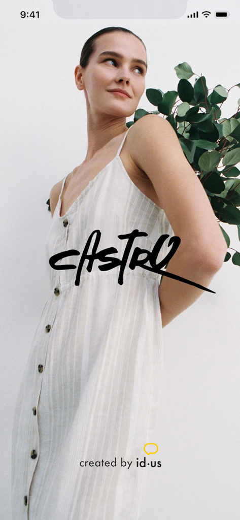 A woman wearing a white striped button down dress with the Castro logo