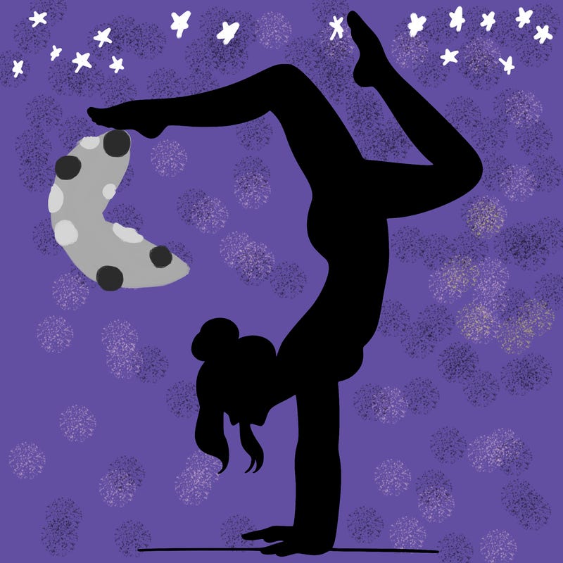 a woman doing a handstand