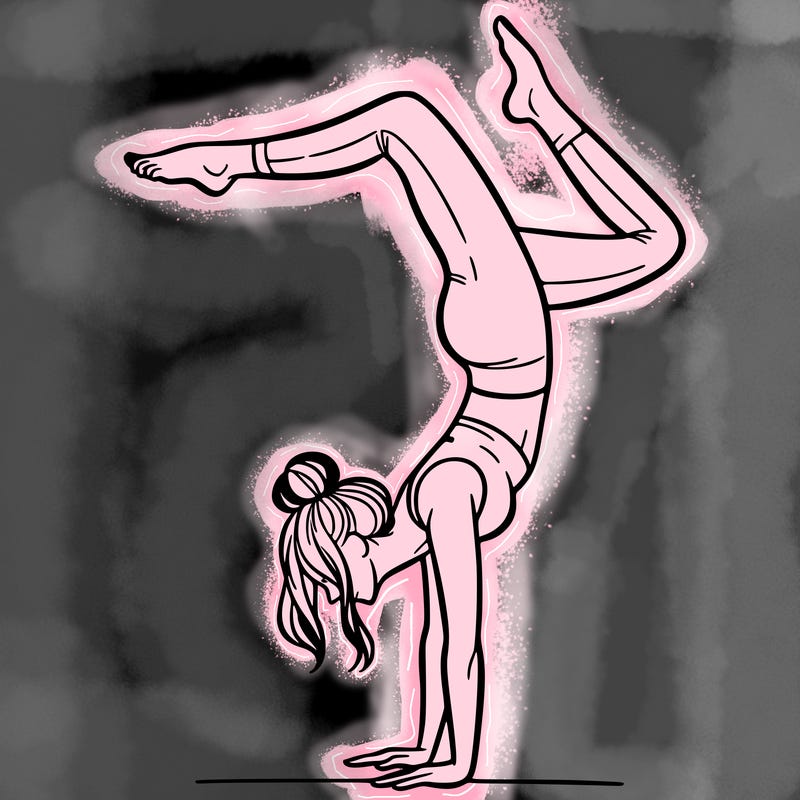 a woman doing a handstand