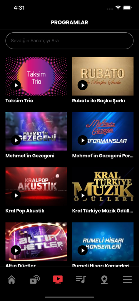 Screenshot dell'app KRAL che mostra un elenco di programmi musicali e video turchi con una barra di ricerca e un menu di navigazione