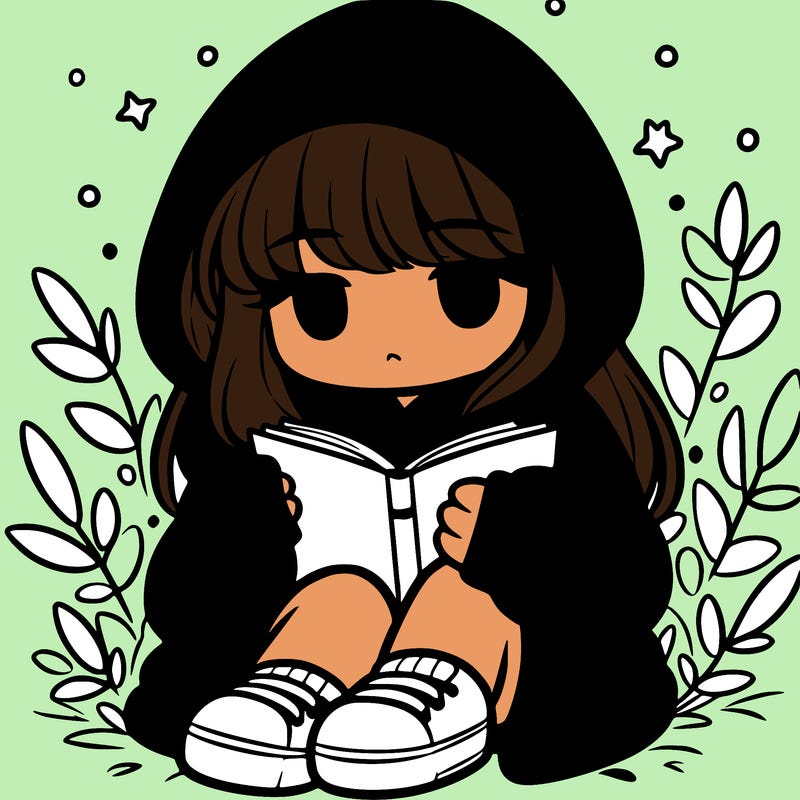 girl in oversized hoodie reading a book